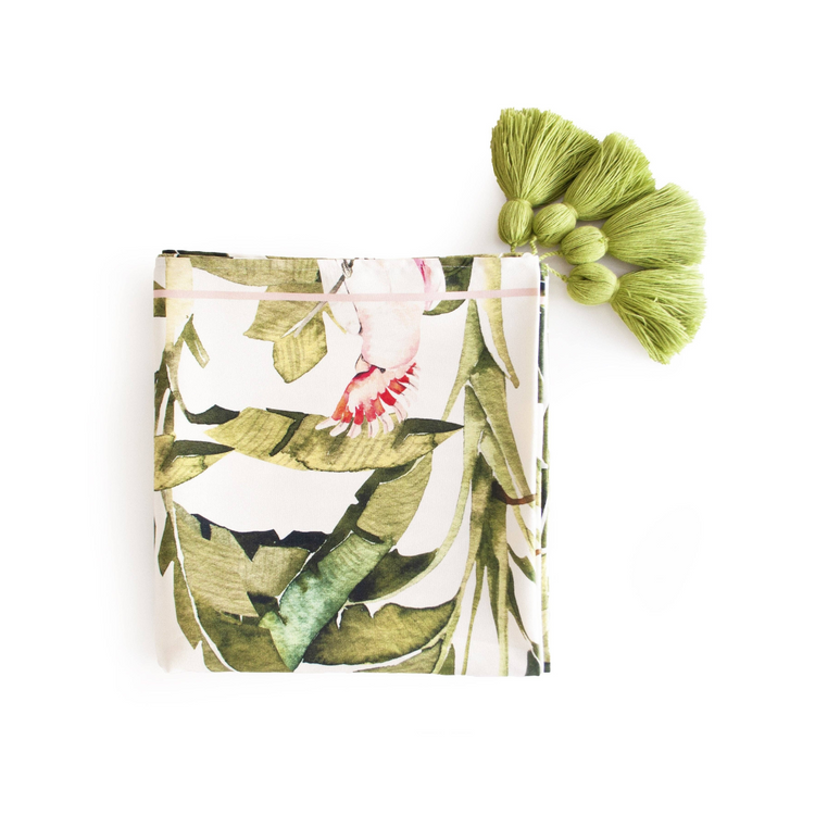 Amazon 18x55 inch table runner, featuring a bold and vibrant forest pattern, placed on a table