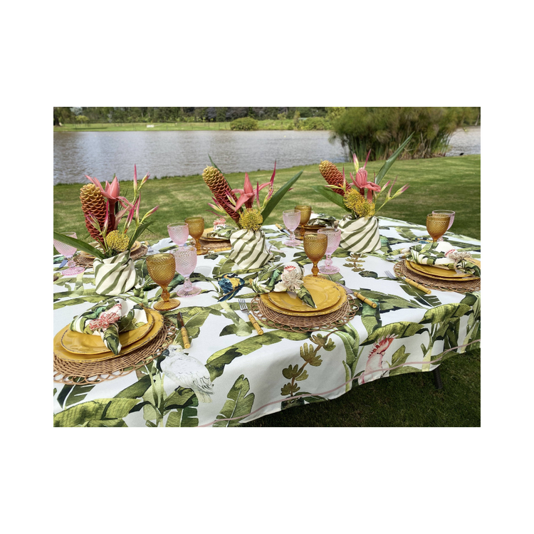 Amazonas 59x106.2 inch tablecloth, featuring a bold and vibrant artistic pattern, draped over a dining table