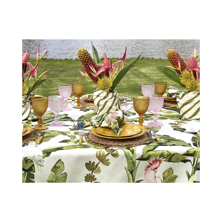 Amazonas 59x106.2 inch tablecloth, featuring a bold and vibrant artistic pattern, draped over a dining table