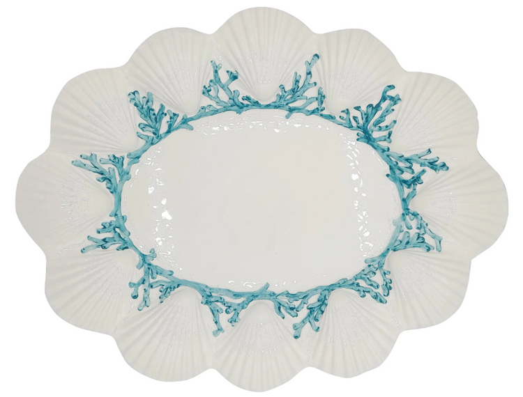Decorative plate with blue coral design on a white background