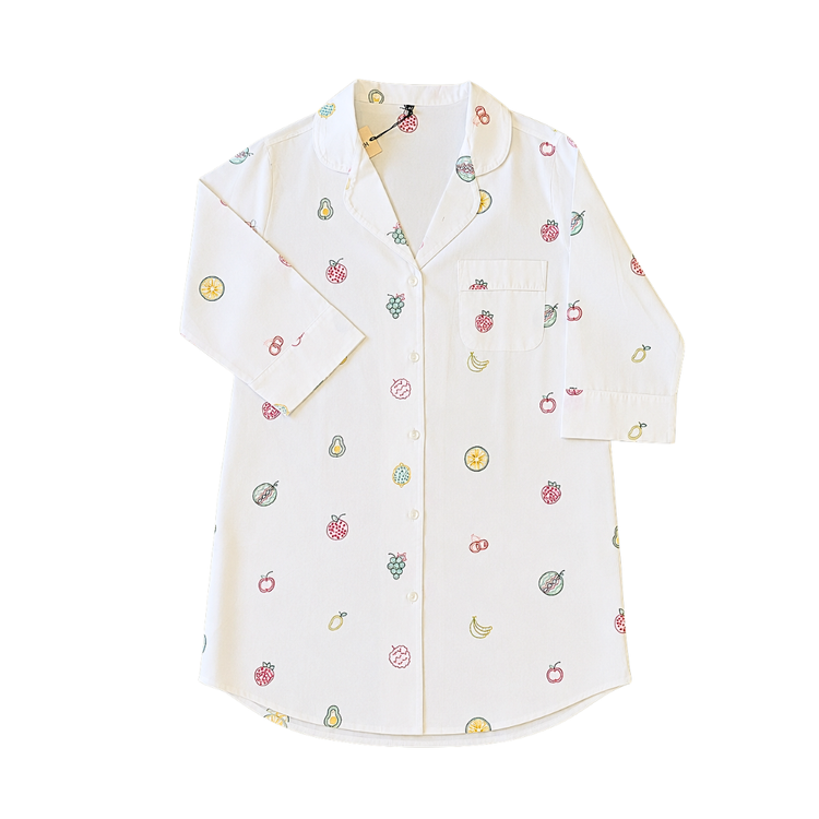 White shirt with colorful fruit patterns on a white background. Tailored size small white long-sleeve cotton pajama button-down shirt with vibrant, delicate hand-embroidered colorful fruit salad details.