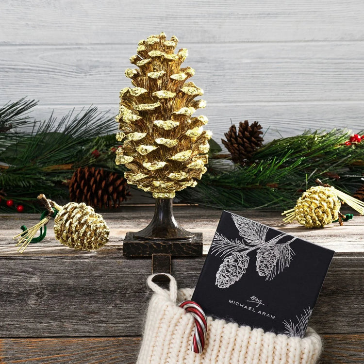 Michael Aram pine cone stocking holder, metal with pine cone design, for holiday decoration