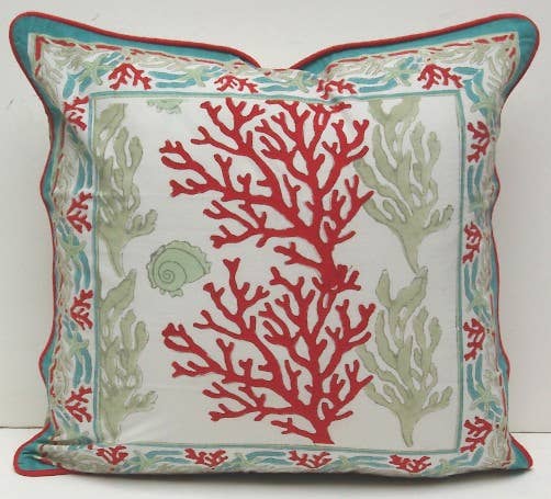 The image features an 18x18 inch throw pillow with a vibrant coral reef block print design. The pillow displays an intricate pattern of red and green coral branches, highlighted against a light background.