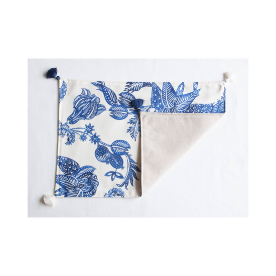 Costa blu placemats, set of 8, laid out on a dining table, showcasing a coastal inspired design