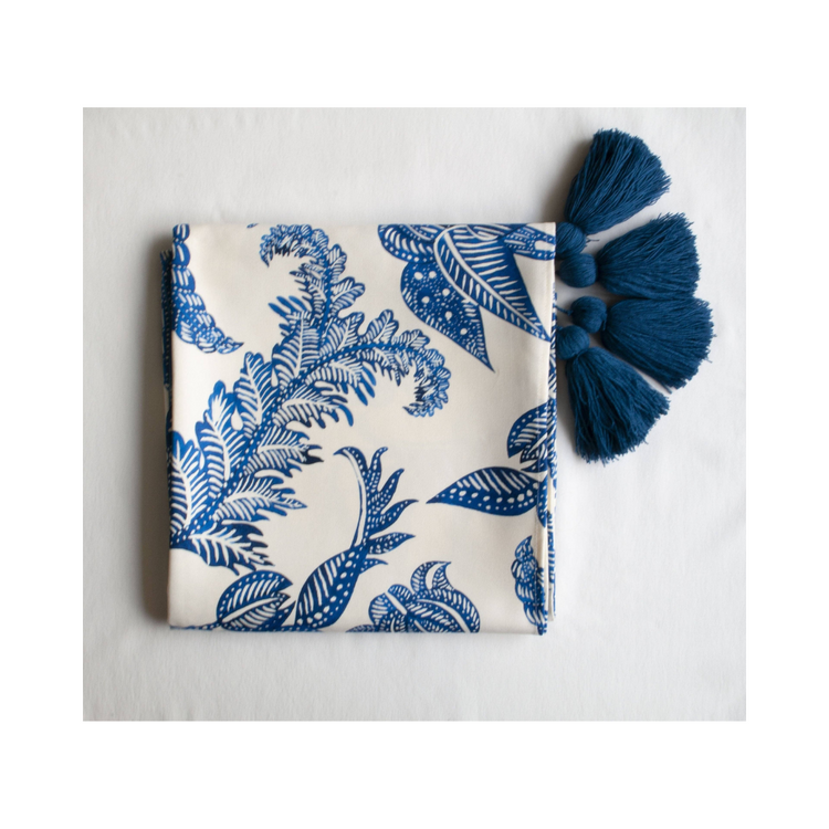Costa blu 59x12 inch tablecloth, featuring cool blue tones, draped over a dining table.