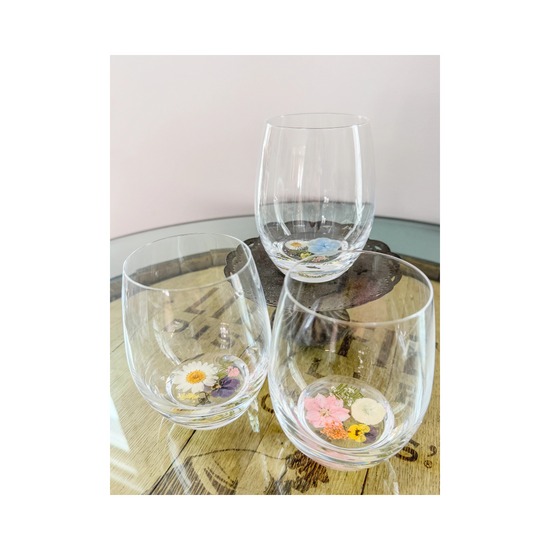 Crystal flower stemless wine glass made with real flowers in resin for an elegant sip. Perfect for spring summer soirees.