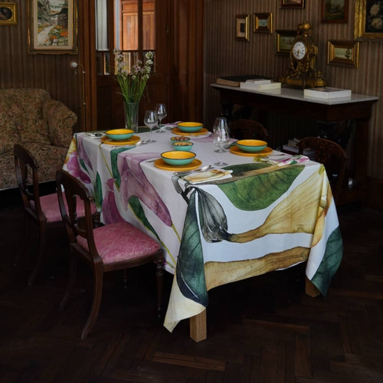 Datura 87x87 inch tablecloth, featuring a bold floral print on a high-quality fabric, displayed on a dining table