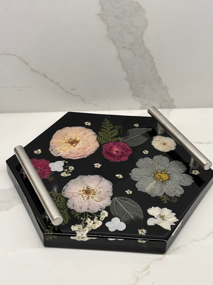 Hexagonal tray with floral design on a marble surface